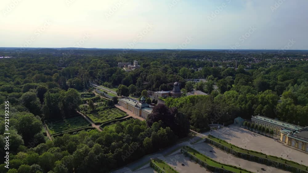 Sunny summer day Potsdam sanssouci Palace showing the beautiful green gardens and surrounding area. Majestic aerial view flight fly reverse drone Sunny summer day Potsdam sanssouci Palace showing the beautiful green gardens and surrounding area. Majestic aerial view flight fly reverse drone