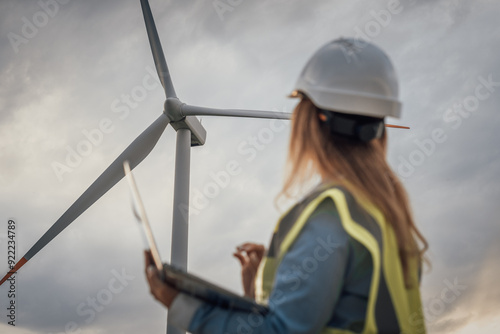 Cuadro en lienzo An Engineer is thoroughly Evaluating the Performance of Wind Turbines within the