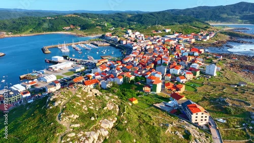 fishing village in North of Spain in Galicia, the drone view of Muxia town at sunset. Camino de Faros in Spain, Spanish Camino de Santiago pilgrimage photo