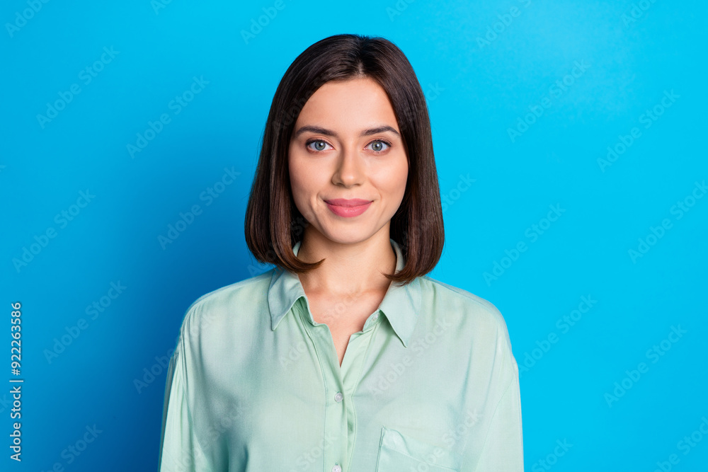 Photo of good mood cheerful nice positive woman with bob hairstyle dressed turquoise blouse smiling isolated on blue color background Photo of good mood cheerful nice positive woman with bob hairstyle dressed turquoise blouse smiling isolated on blue color background