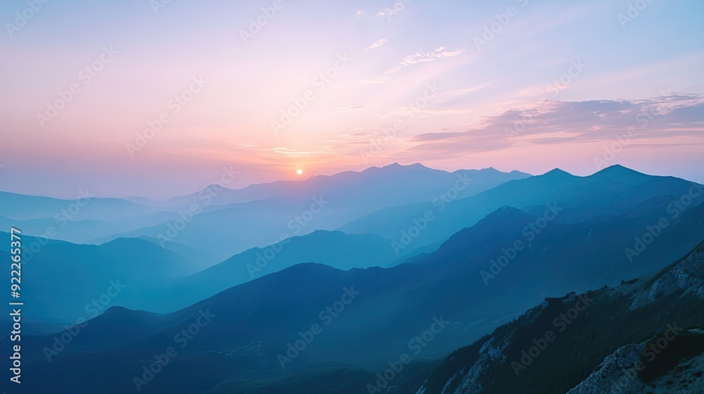 Panoramic top view of a mountain range at sunset, with ample space for text in the sky