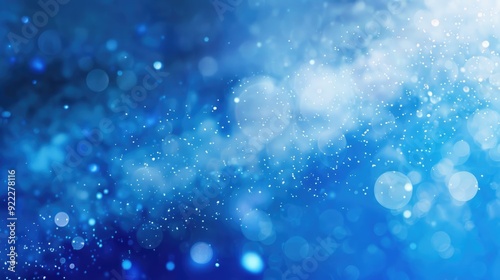 Abstract blue blurry unfocused sparkle glitter blue bokeh background wallpaper with copy space. Blue Christmas glitter design background.