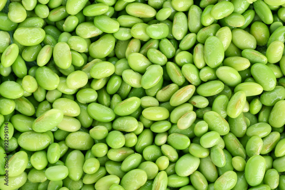 Raw green edamame soybeans as background, top view Raw green edamame soybeans as background, top view