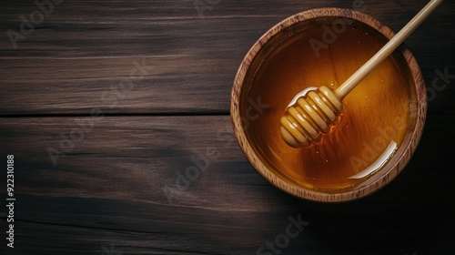 Organic Luxury: Pure Manuka Honey with Honey Dipper on Dark Wooden Surface