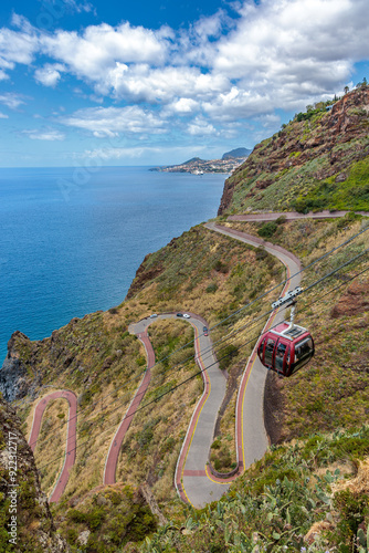 Obraz na płótnie Cristo Rei. Jesus monument on top of a cliff overlooking the Atlantic Ocean and a cable car leading down to the beach on the island of Madeira w salonie