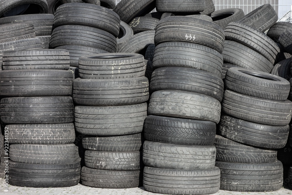 Piles of old rubber tyres, with worn out treads Piles of old rubber tyres, with worn out treads