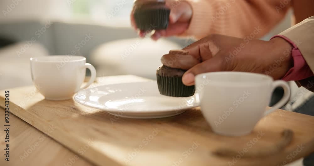Hands, cupcake and plate on table with coffee for visit, friends or social in home. Closeup, snack and people for quality, time and together for bond in living room by delicious, chocolate or dessert Hands, cupcake and plate on table with coffee for visit, friends or social in home. Closeup, snack and people for quality, time and together for bond in living room by delicious, chocolate or dessert