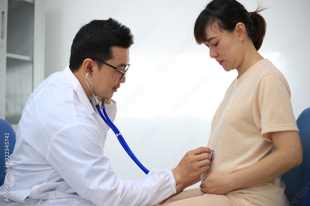 Male doctor with experience examining young pregnant women Male doctor with experience examining young pregnant women