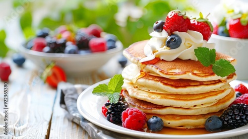 Delicious Pancakes with Berries and Whipped Cream