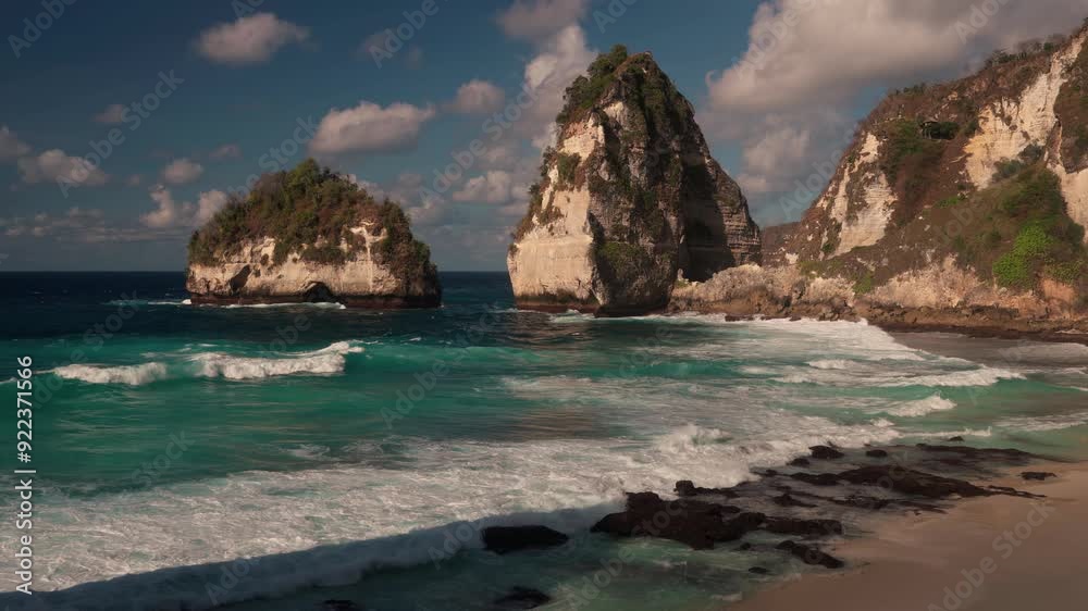 Bali famous travel destination and most recognizable tropical beach Bali with scenery mountain rocks on ocean on nature background. Diamond Beach Bali, Indonesia 4K Bali famous travel destination and most recognizable tropical beach Bali with scenery mountain rocks on ocean on nature background. Diamond Beach Bali, Indonesia 4K