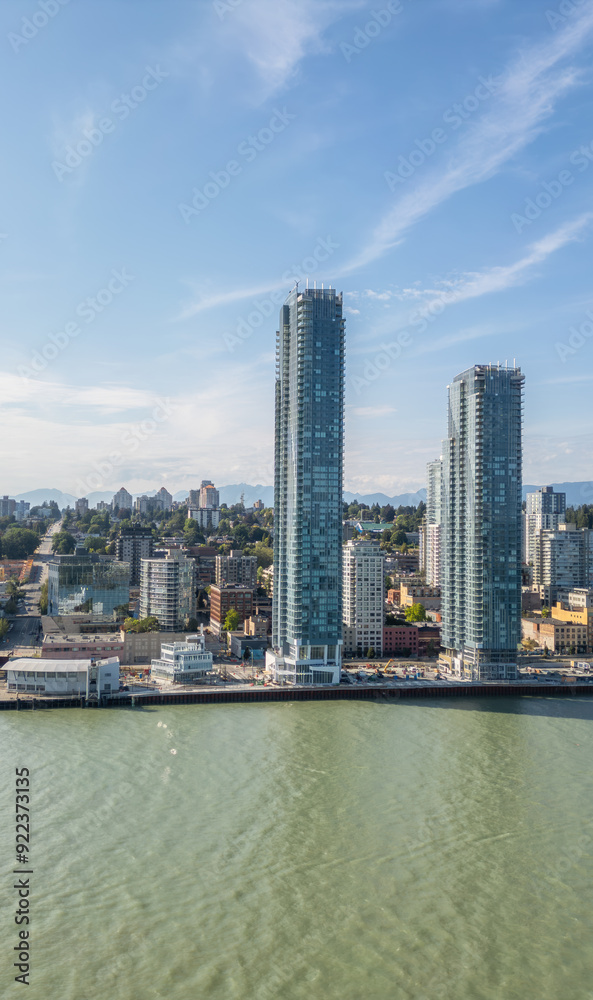 Fototapeta premium Modern City by river, sunny summer day. New Westminster, Vancouver, BC, Canada