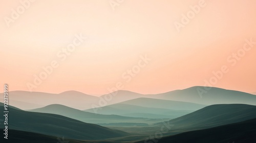 Pastel coloured sky over rolling hills at sunset