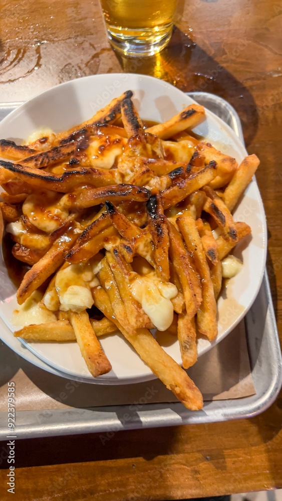 Canadian Poutine French fries with gravy Canadian Poutine French fries with gravy