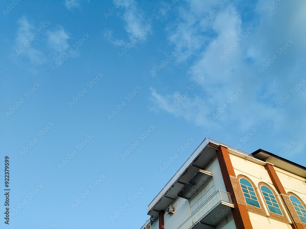 Tall building 4
Tall building against a background of blue sky and clouds Tall building 4
Tall building against a background of blue sky and clouds