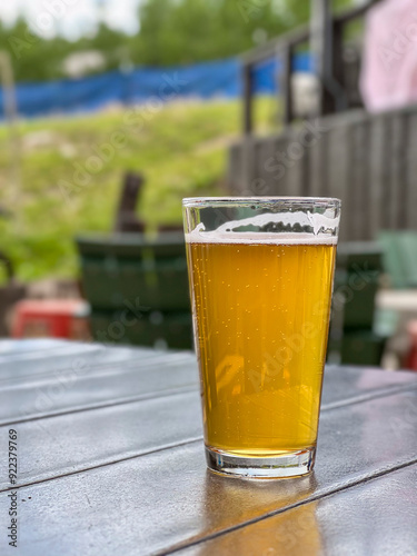 Glass of beer on tabletop