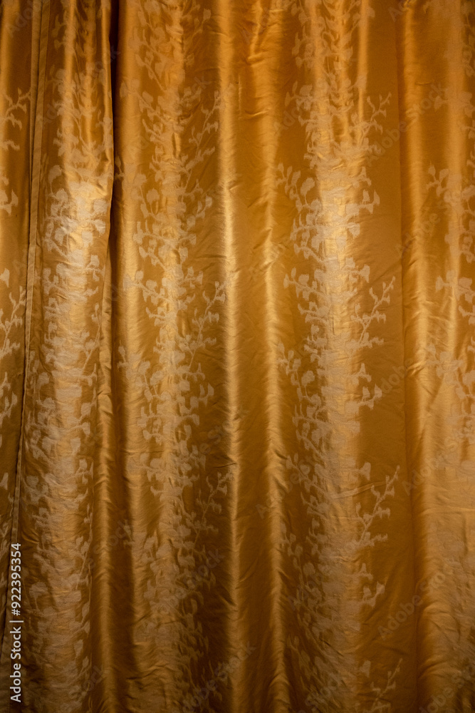 Golden curtain with floral pattern background