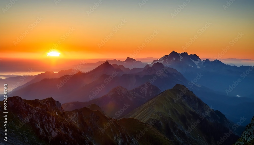 Golden hour paints snow-capped peaks with vibrant hues, casting long shadows across a misty valley Golden hour paints snow-capped peaks with vibrant hues, casting long shadows across a misty valley