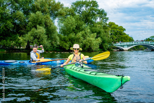 Photography Active outdoor lifestyle: Sea kayakers having fun on long pond in the toronto is
