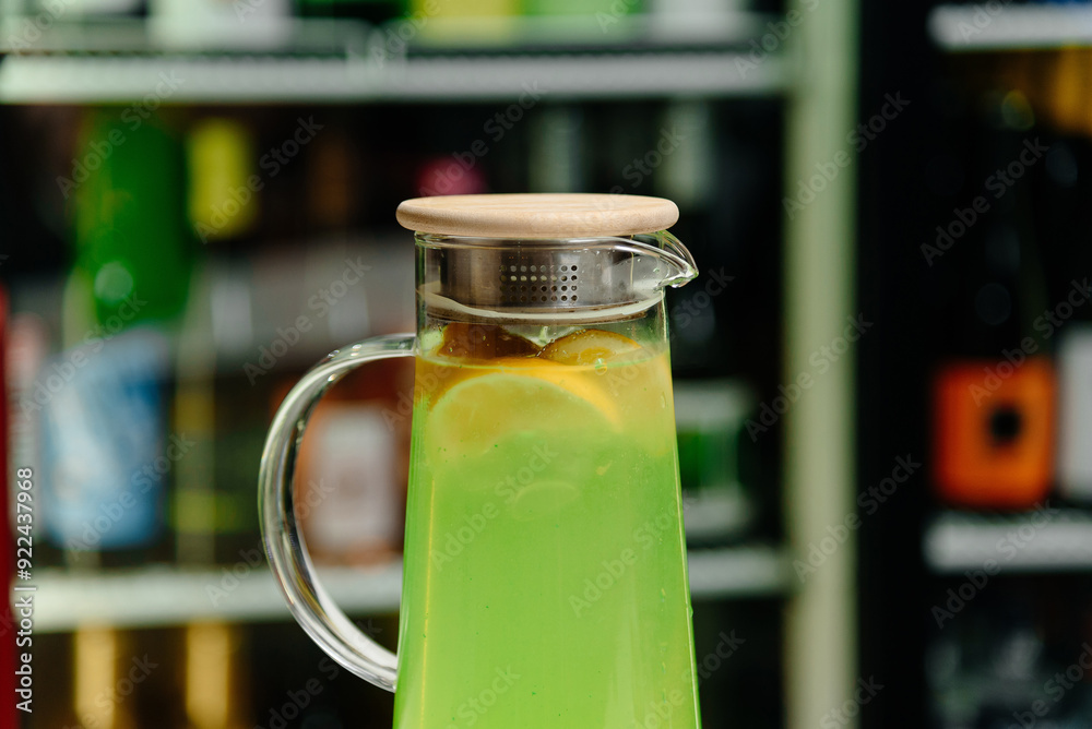 jug with lime juice and lemon on bar counter, delicious cocktail, nightlife concept jug with lime juice and lemon on bar counter, delicious cocktail, nightlife concept