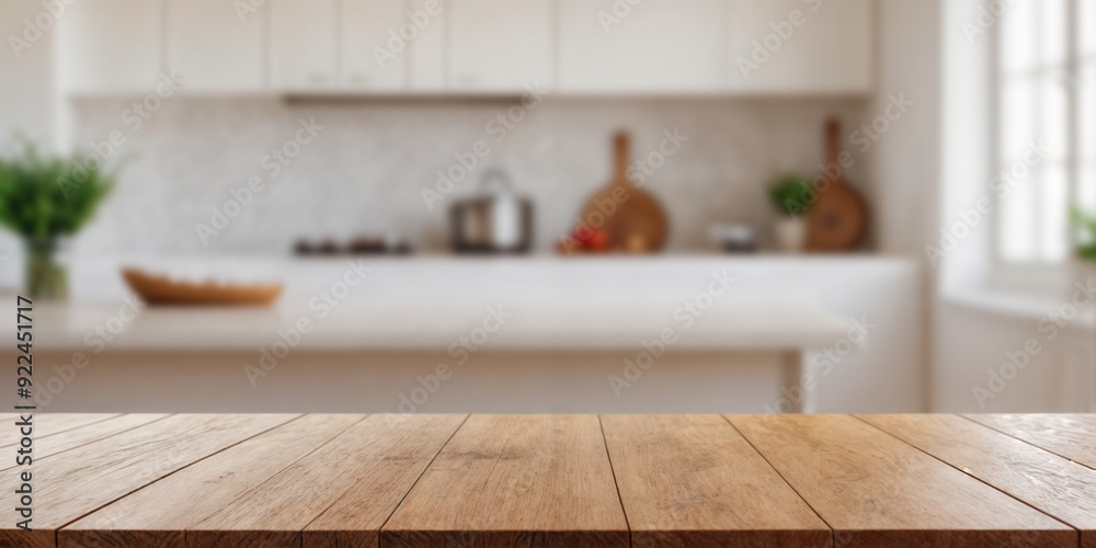 Green Empty wooden table with the bright white interior of the kitchen as a blurred background behind the bokeh golden sunshine