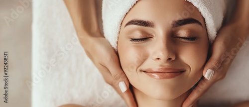 Close up of hands of professional beautician making skin treatment for woman photo