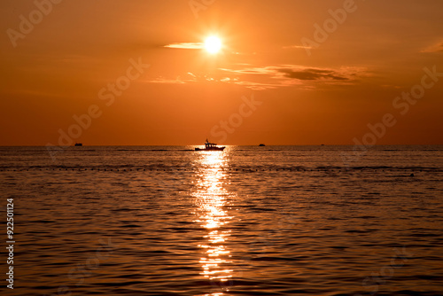 sunset by the ocean photo