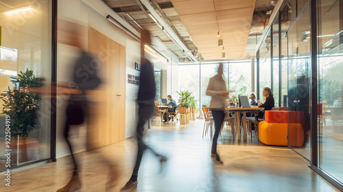 Long exposure shot of crowd of business people walking in bright office lobby fast moving with blurry