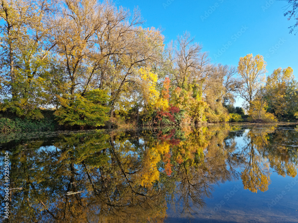 Beautiful Autumn View with reflection at Tundja River, near Ustrem Village, Bulgaria Beautiful Autumn View with reflection at Tundja River, near Ustrem Village, Bulgaria