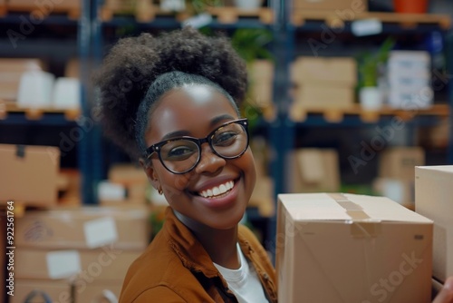 Happy young black female Handling shipping and logistics in startup company office photo