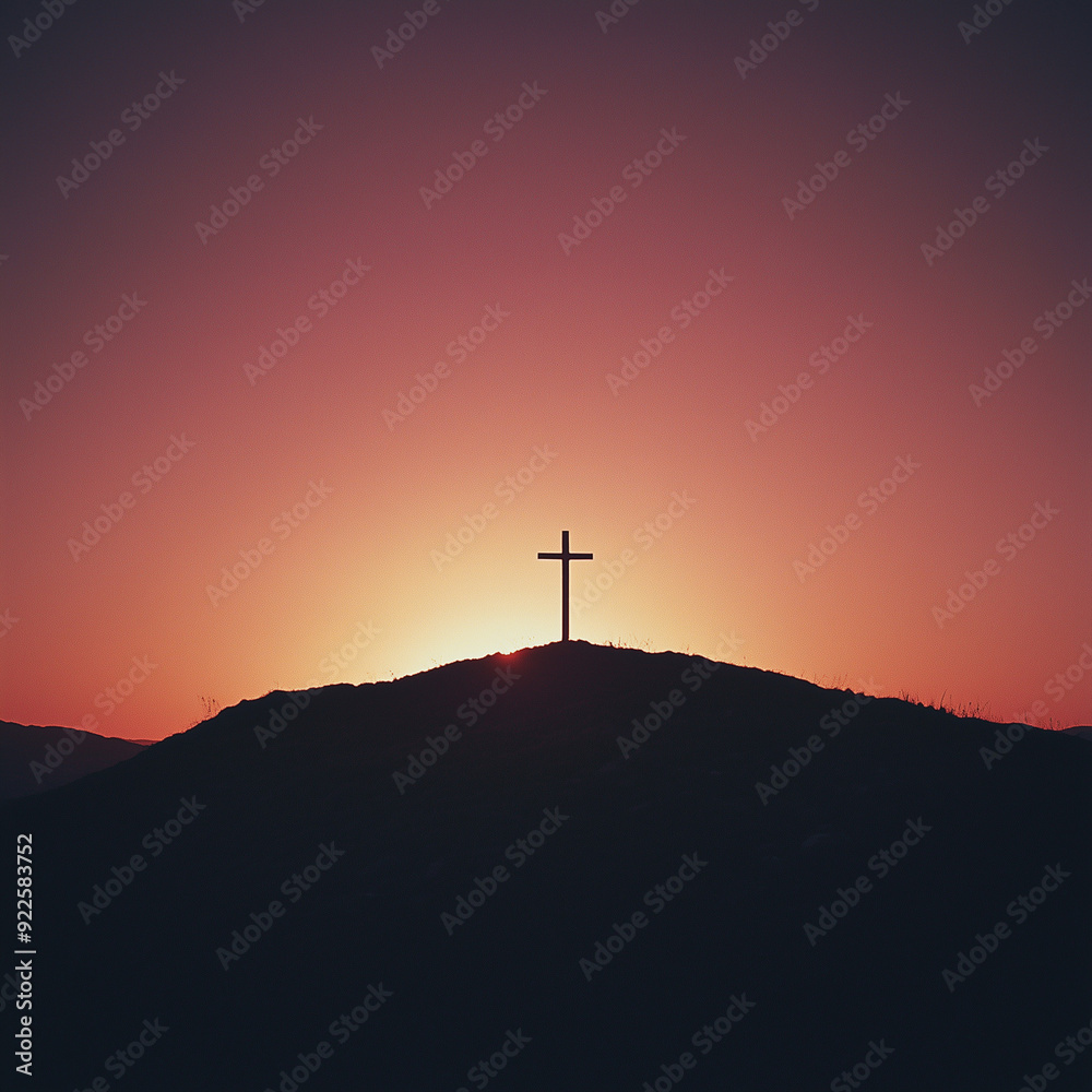 Obraz premium Silhouette of a cross on a hill during sunset