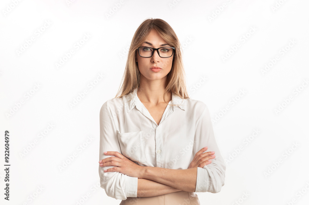 Strict Lady Boss. Serious Businesswoman Standing Crossing Hands Looking At Camera On White Studio Background. Isolated