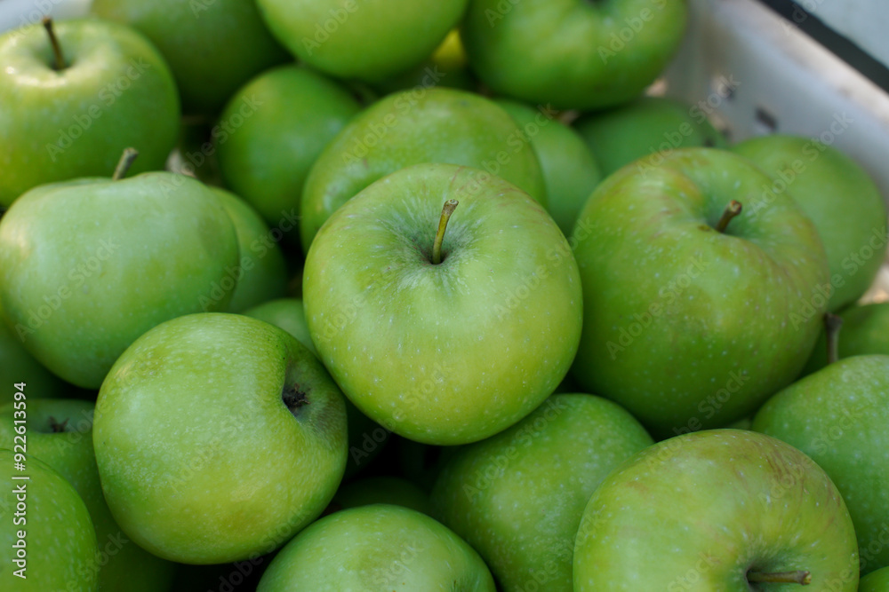 green apples close-up in a basket. green apples close-up in a basket.