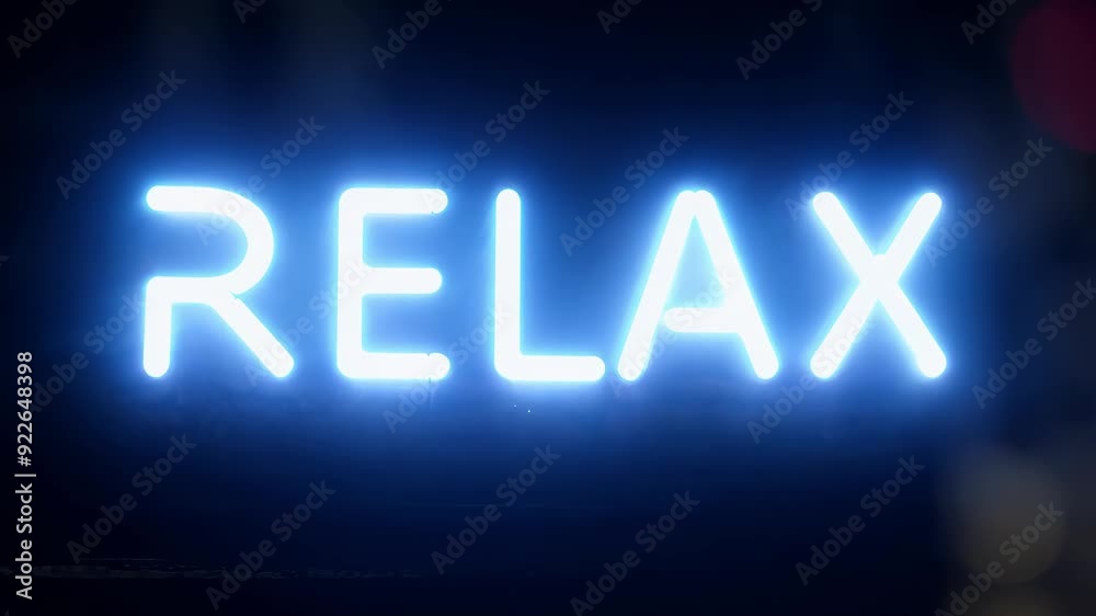 A vibrant neon sign glowing in the night encourages viewers to unwind and embrace serenity amid the city's hustle. A vibrant neon sign glowing in the night encourages viewers to unwind and embrace serenity amid the city's hustle.