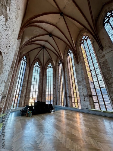 Interior of the Couvent des Dominicains de Guebwiller Featuring Gothic Arched Windows and a Spacious Wooden Floor, Florival, Haut-Rhin, Alsace, France