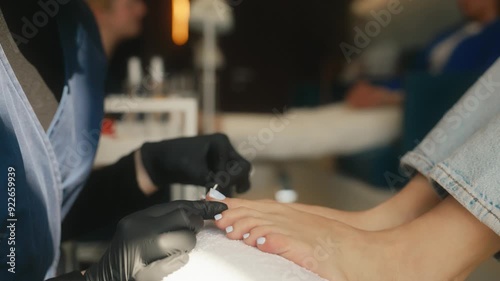 Barefoot client at pedicure procedure in luxury beauty spa salon