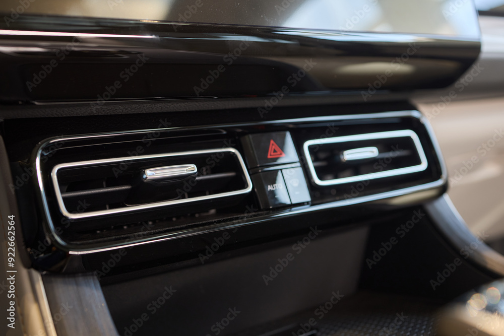 Closeup of car dashboard air vents near gear shift Closeup of car dashboard air vents near gear shift