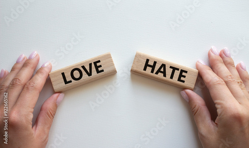 Love vs Hate symbol. Concept word Love vs Hate on wooden blocks. Businessman hand. Beautiful white background. Business and Love vs Hate concept. Copy space