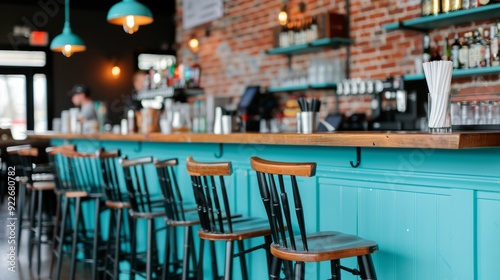 Modern Bar Interior With Wooden Stools and Brick Wall in Afternoon Light