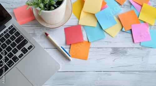 Workspace With Sticky Notes and Stationery on a Light Blue Wooden Table