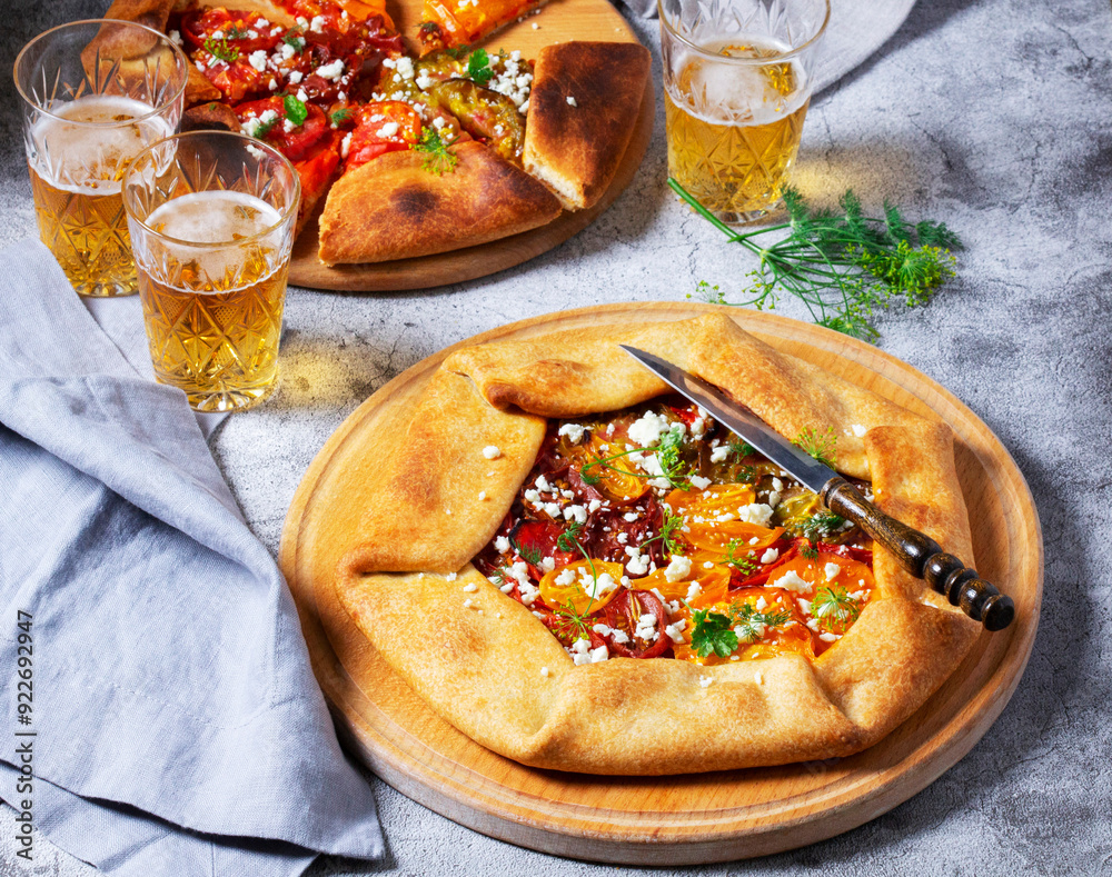 Traditional open pie galette with tomatoes, cheese and herbs, served with beer or wine.