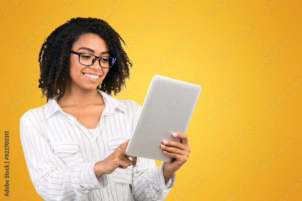 Checking Schedule. Smiling black woman checking appointment on personal tablet over white background, copy space Checking Schedule. Smiling black woman checking appointment on personal tablet over white background, copy space