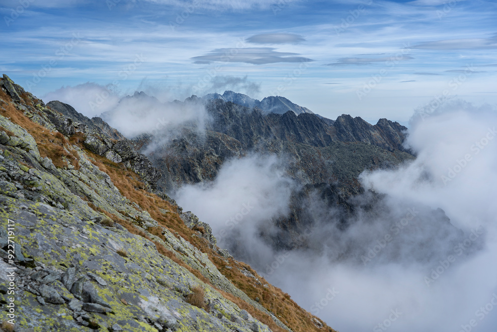 TANAP high tatras (Tatry). Hiking trail to Krywan (Krivan). View of Polish mountains. Autumn colours, fog TANAP high tatras (Tatry). Hiking trail to Krywan (Krivan). View of Polish mountains. Autumn colours, fog