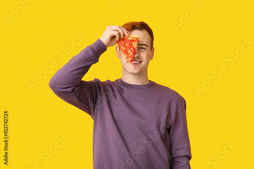Young man holding piece of ...