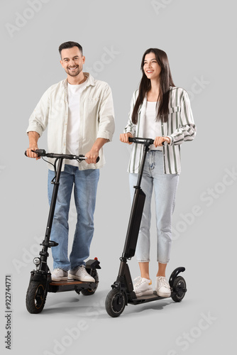 Young couple riding electri...