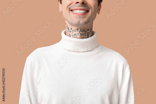 Happy handsome young tattoo...