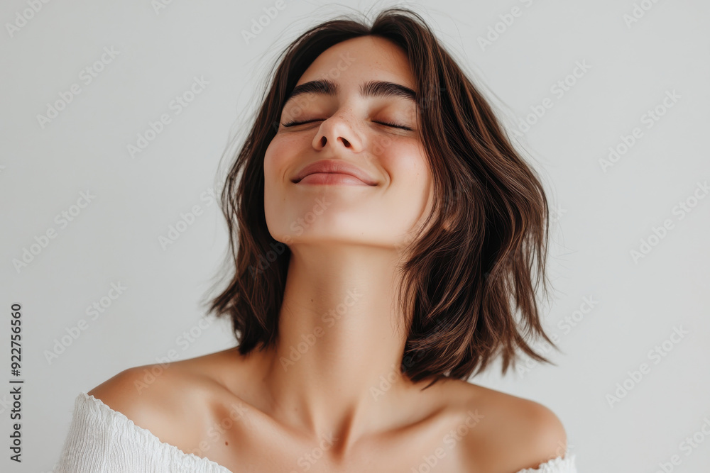 Fototapeta premium A close up of a woman's face with her eyes closed