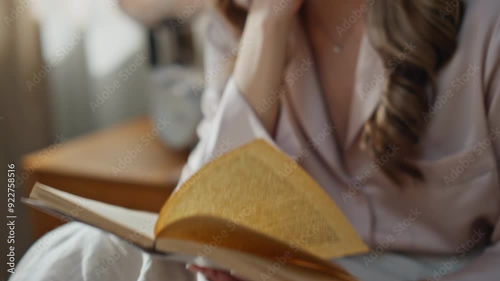 Morning lady hands reading novel at bed closeup. Carefree woman flipping pages Morning lady hands reading novel at bed closeup. Carefree woman flipping pages