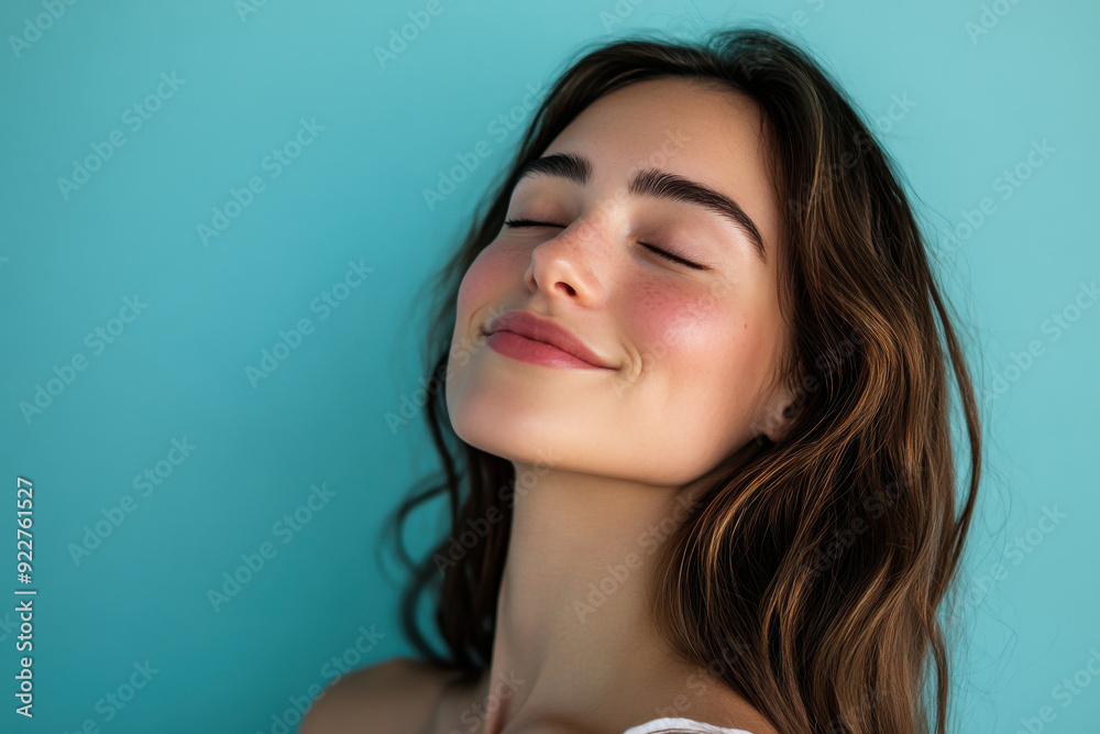 A close up of a woman's face with her eyes closed