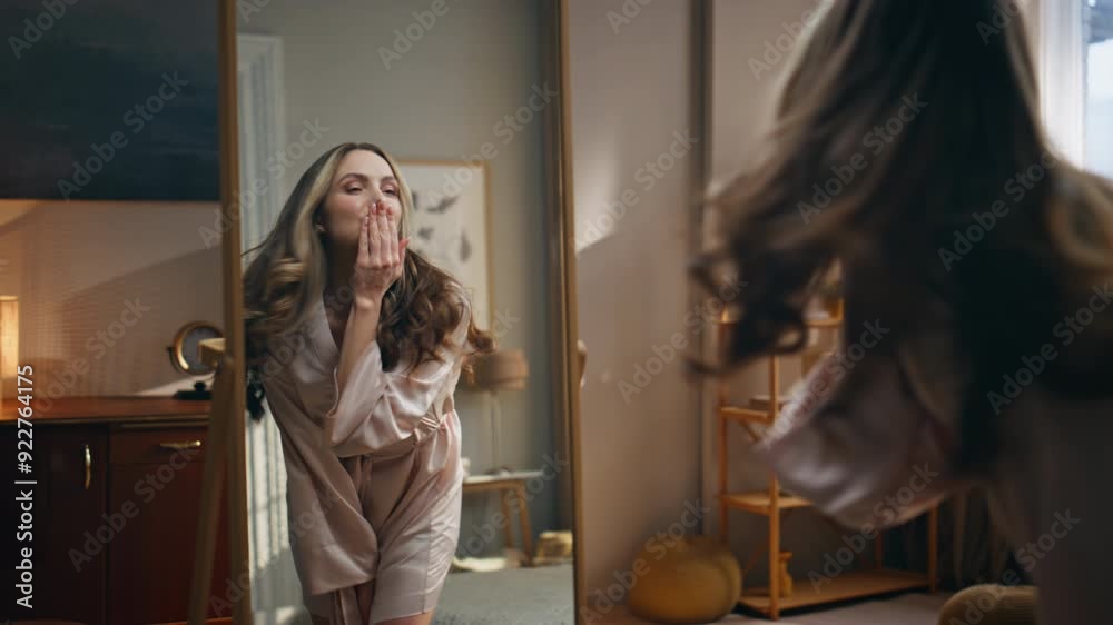 Joyful woman mirror reflection at room zoom out. Excited lady spinning around
