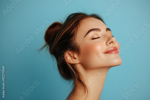 A close up of a woman's face with her eyes closed